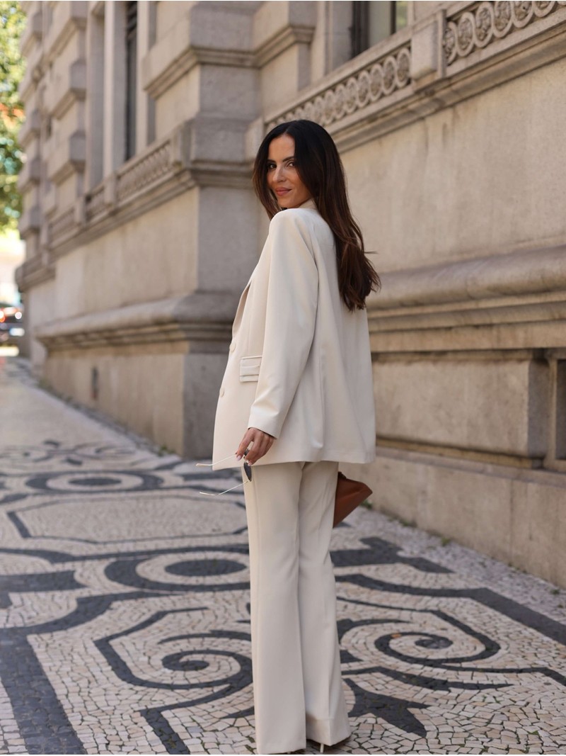 Flared trousers with metallic appliqué details