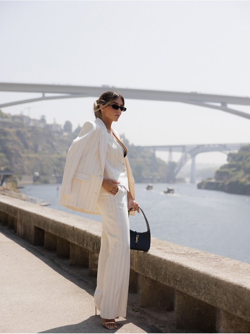 Long trousers in striped fabric