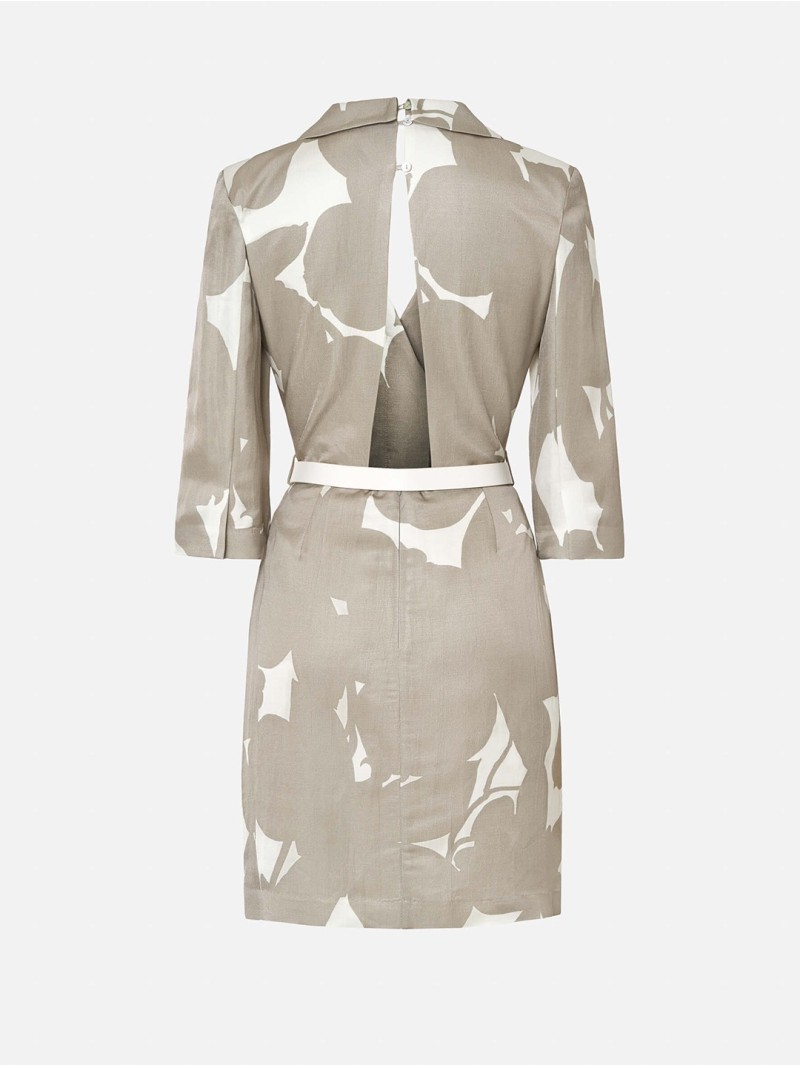 Dress with a flap collar and personalized belt.