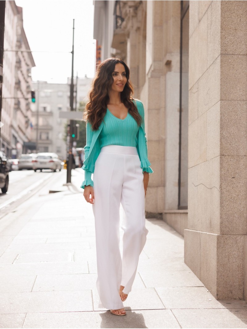 Ribbed knit cardigan with ruffle details