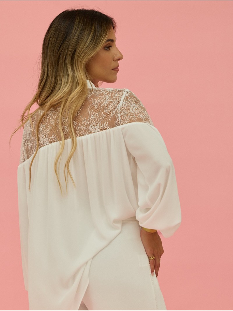 Flowing blouse with lace appliqué